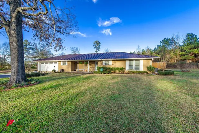 a view of a house with a big yard