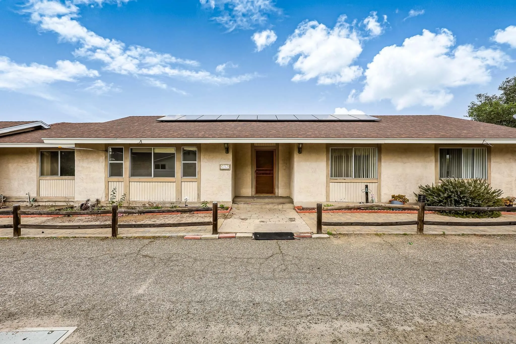 221 Colina Terrace Vista, CA 92084 - Photo 2 of 57 a front view of a house with a garden