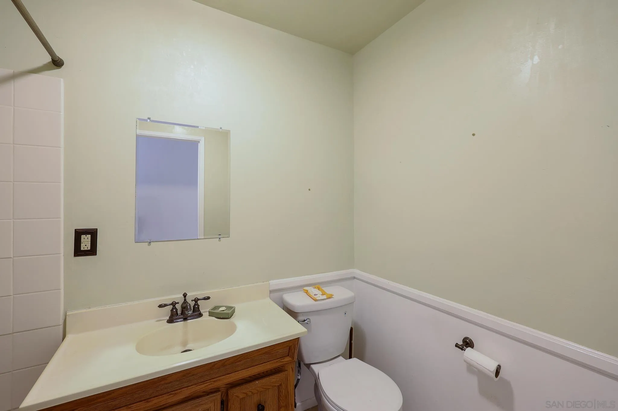 221 Colina Terrace Vista, CA 92084 - Photo 34 of 57 a bathroom with a sink mirror and toilet