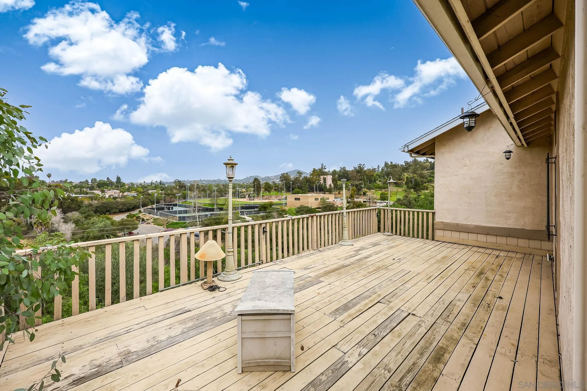 221 Colina Terrace Vista, CA 92084 - Photo 4 of 57 a view of a balcony with wooden floor and fence