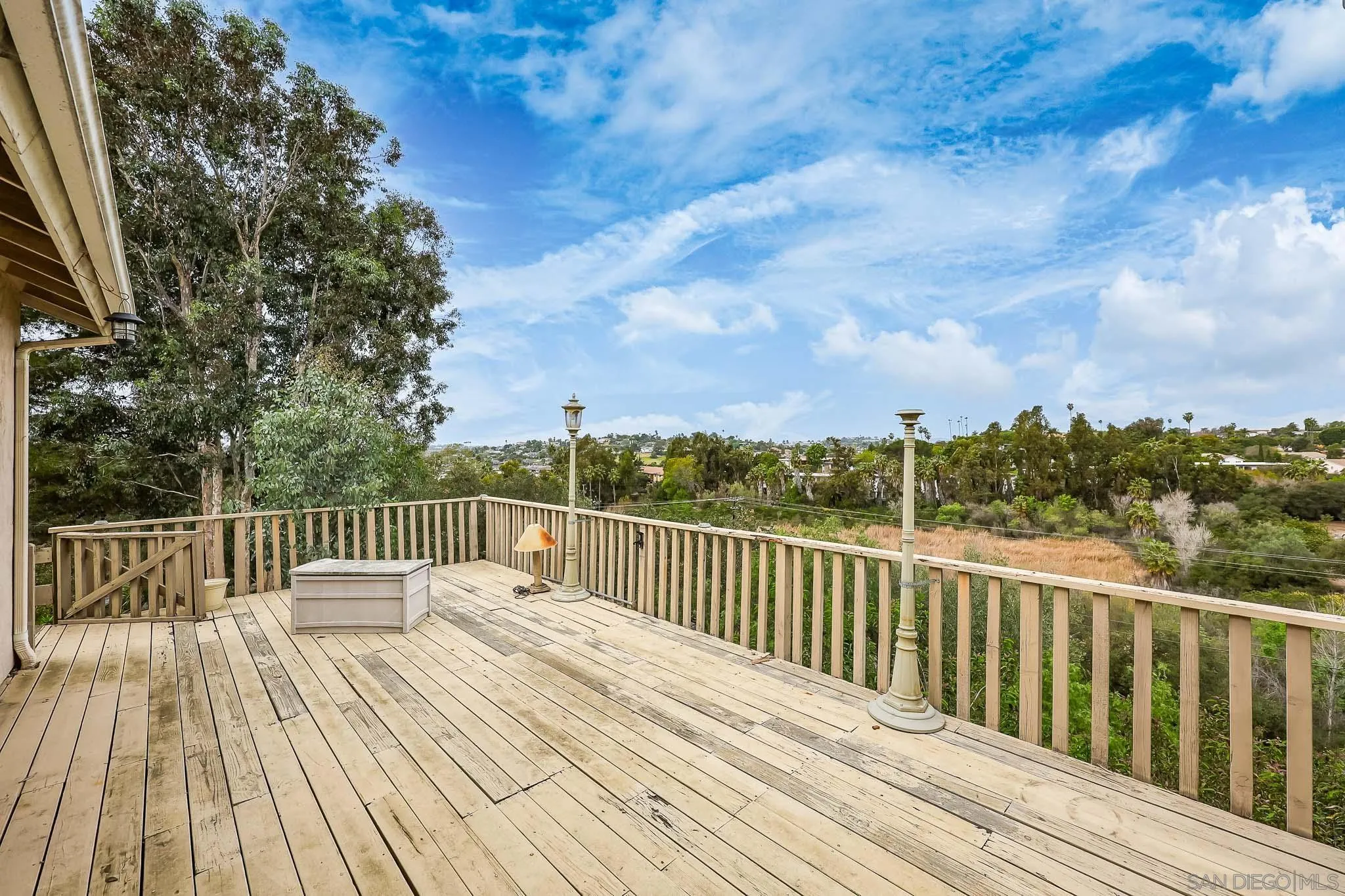 221 Colina Terrace Vista, CA 92084 - Photo 41 of 57 a balcony with wooden floor and fence