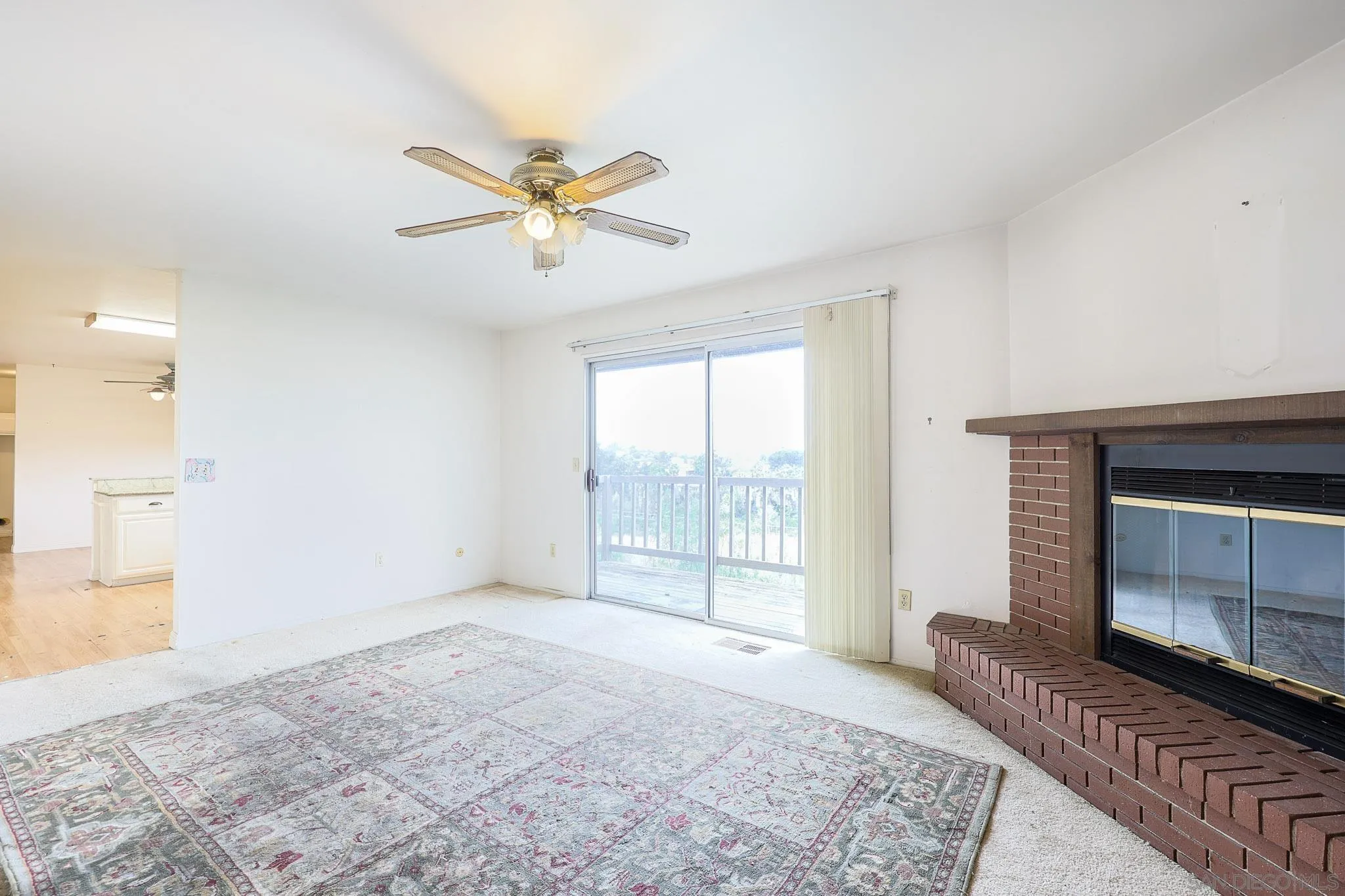 221 Colina Terrace Vista, CA 92084 - Photo 10 of 57 a view of a livingroom with a fireplace and window