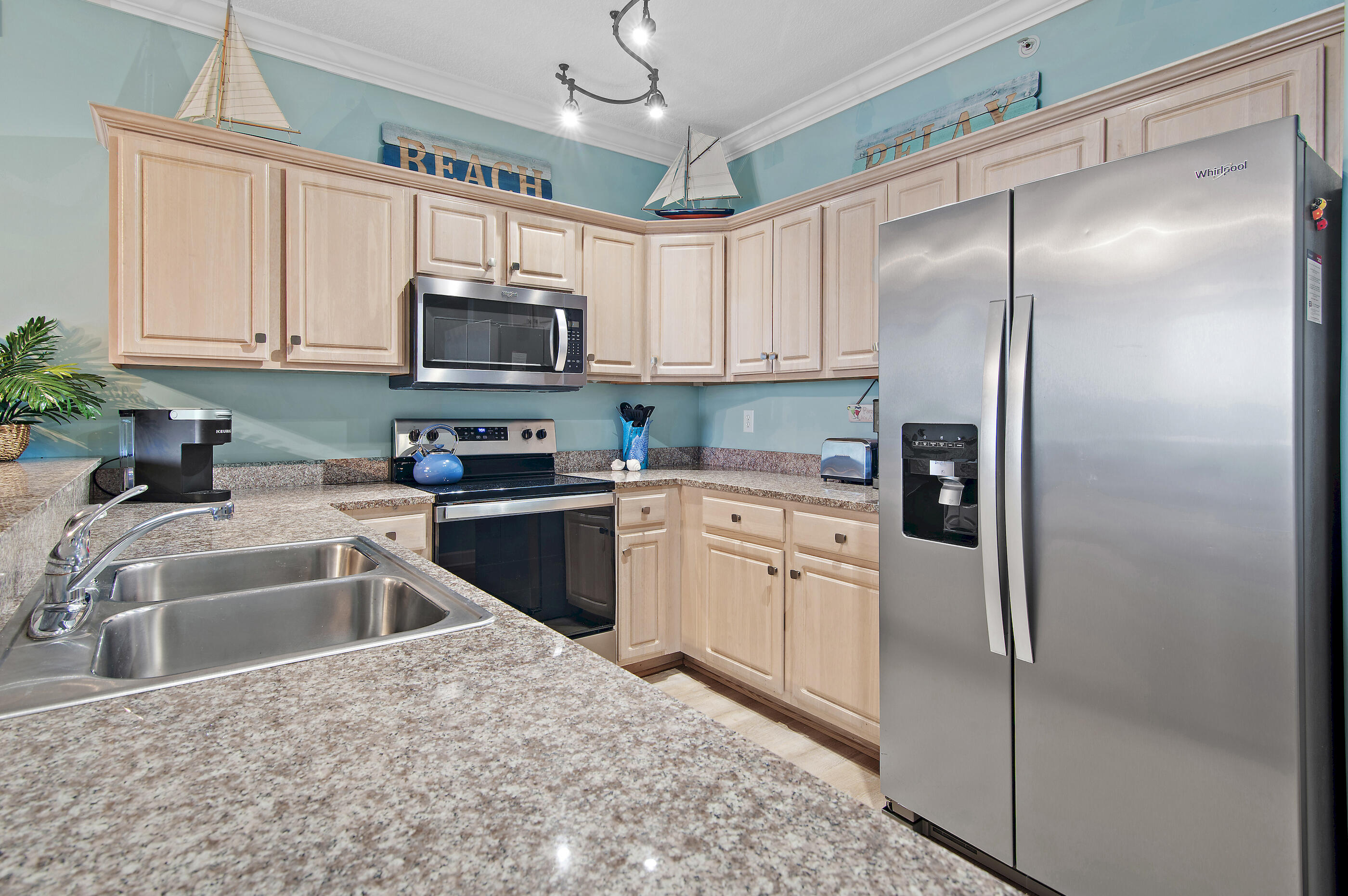 17545 Front Beach Road, Unit 1104 Panama City Beach, FL 32413 - Photo 13 of 31 a kitchen with a refrigerator sink and microwave