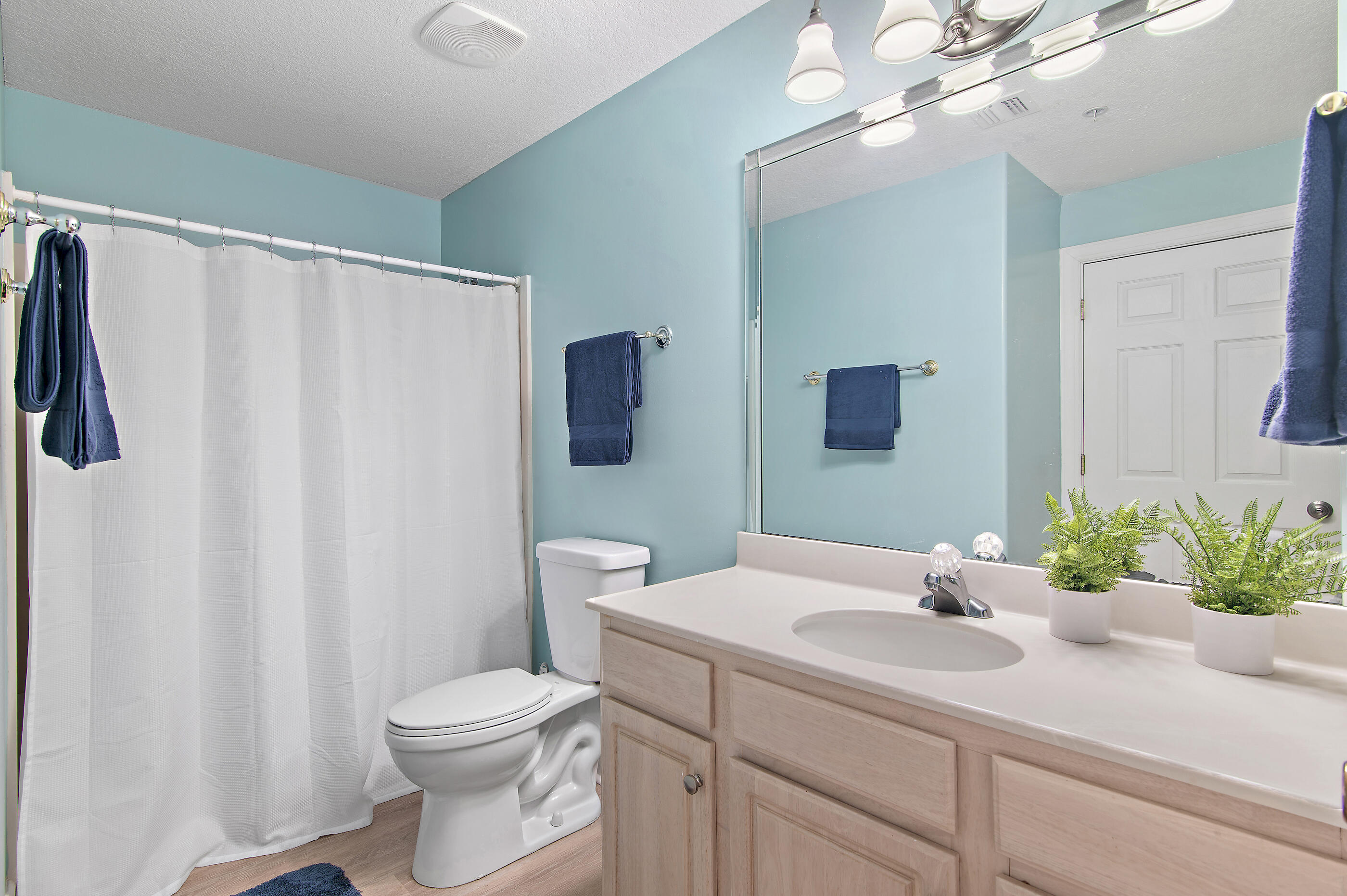 17545 Front Beach Road, Unit 1104 Panama City Beach, FL 32413 - Photo 19 of 31 a bathroom with a sink toilet and shower