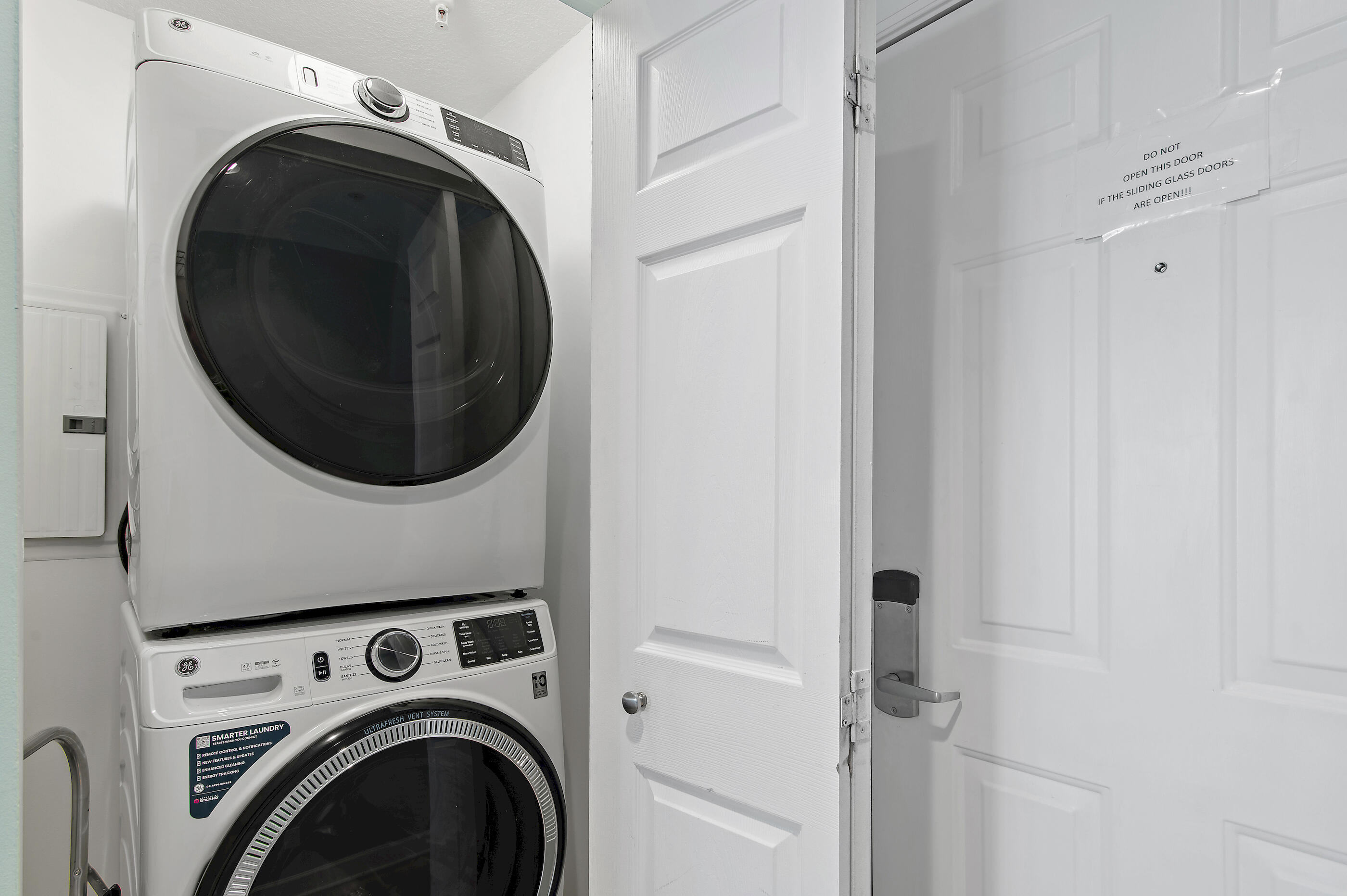17545 Front Beach Road, Unit 1104 Panama City Beach, FL 32413 - Photo 20 of 31 a utility room with dryer and washer