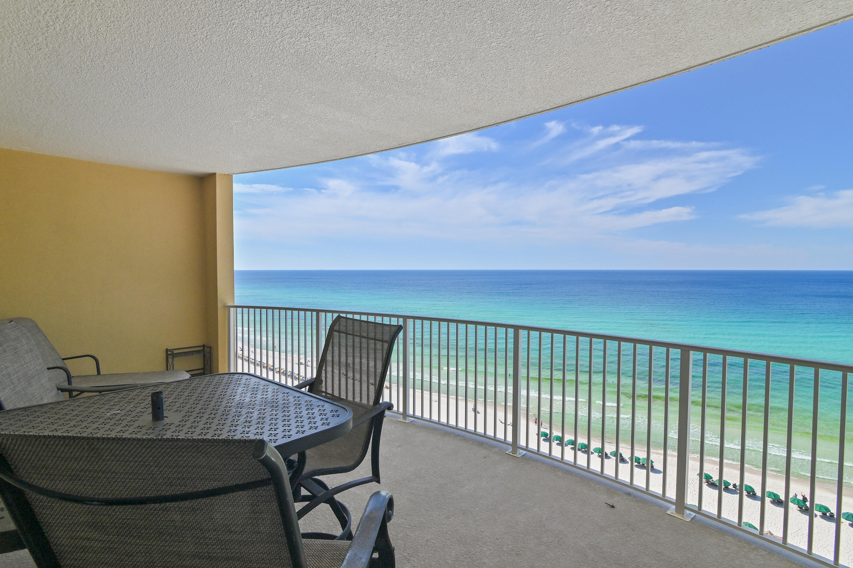 17545 Front Beach Road, Unit 1104 Panama City Beach, FL 32413 - Photo 2 of 31 a view of a balcony with table and chairs