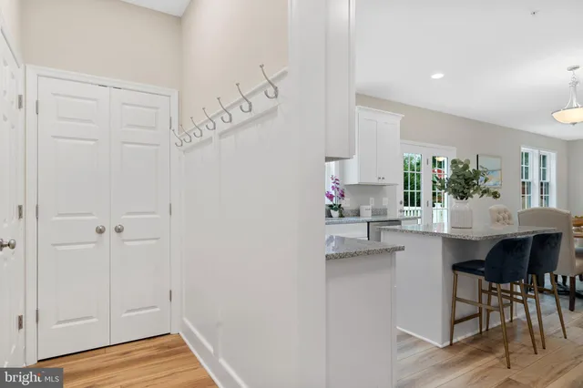 a kitchen with a table and chairs in it