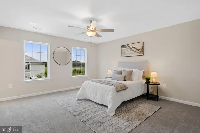 a bed room with a bed and a window