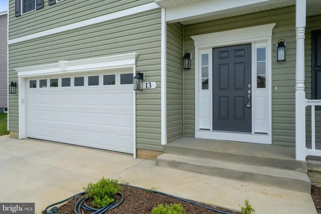 a front view of a house with a garage