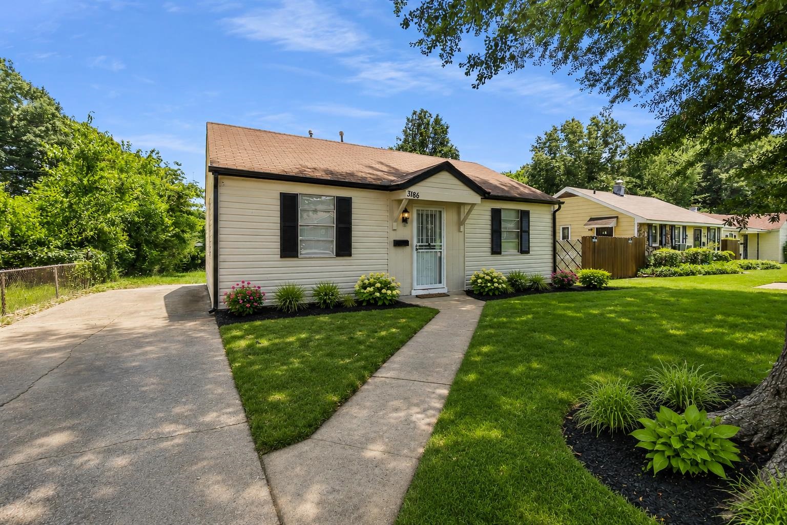 3186 Alta Road Memphis, TN 38109 - Photo 2 of 17 a front view of a house with a yard