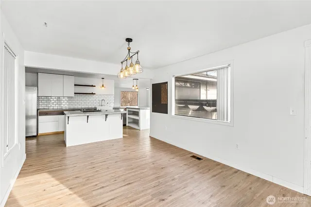 a view of kitchen with wooden floor