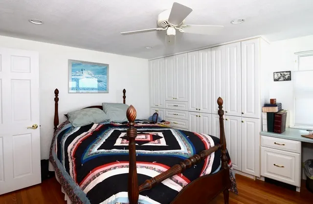 a bedroom with a bed and a closet