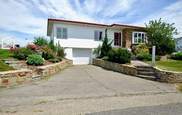 front view of a house with a yard
