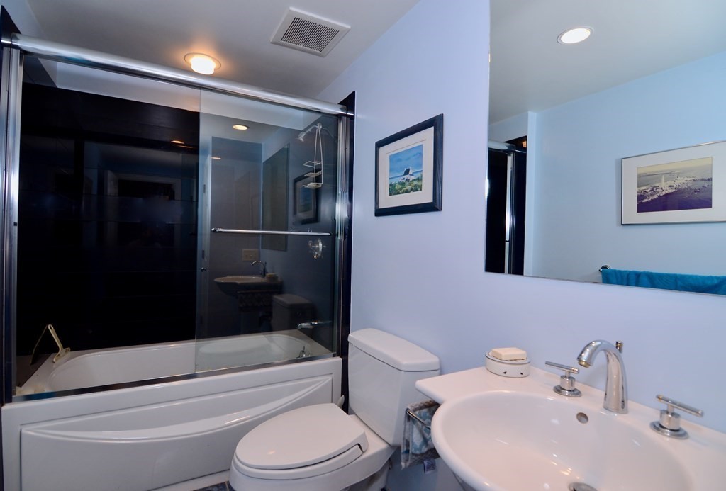 53 Harborview Road Hull, MA 02045 - Photo 10 of 21 a bathroom with a toilet a sink and bathtub