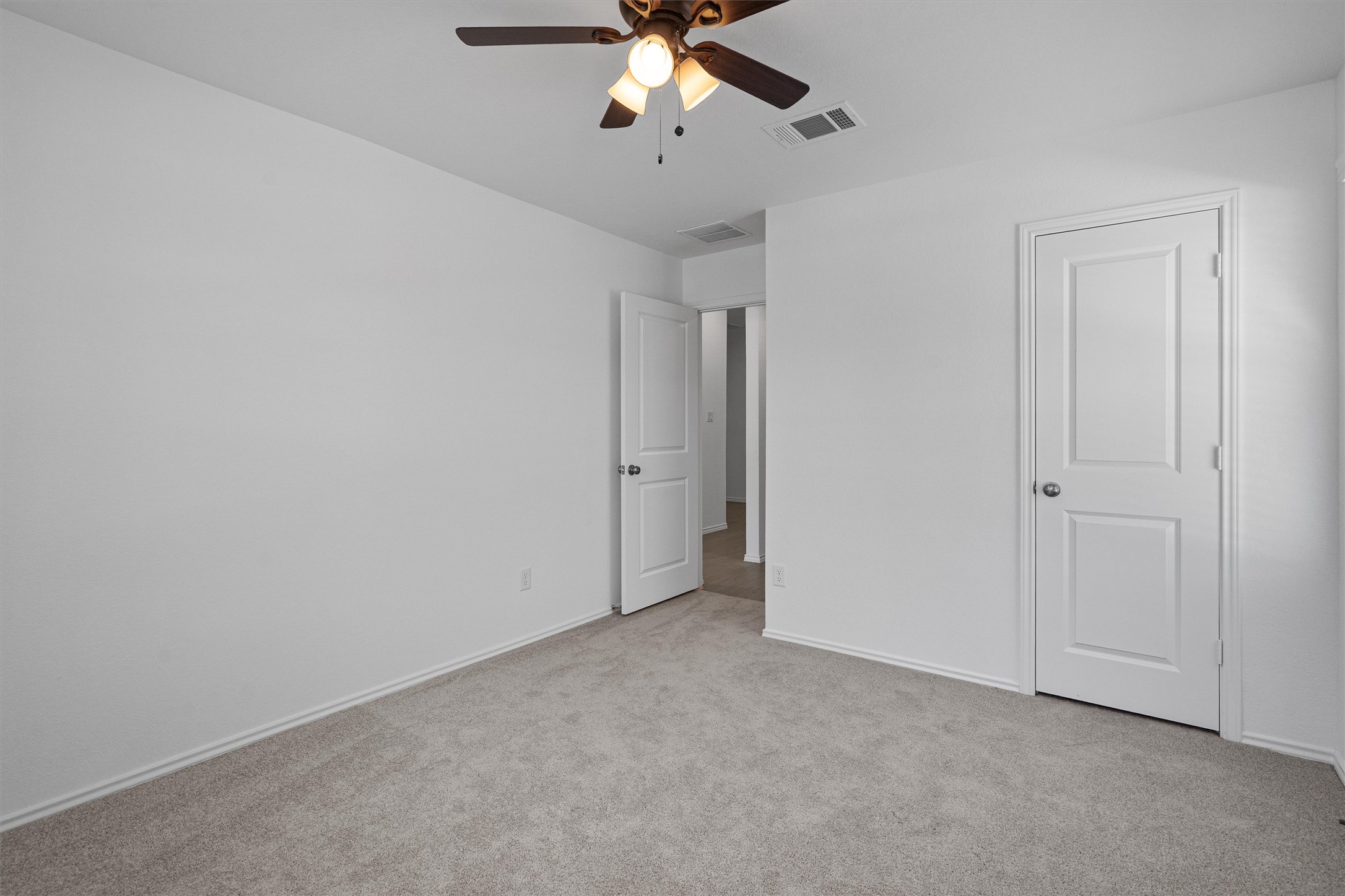 3305 Everett Kyle, TX 78640 - Photo 11 of 21 Guest bedroom featuring light colored carpet and a ceiling fan