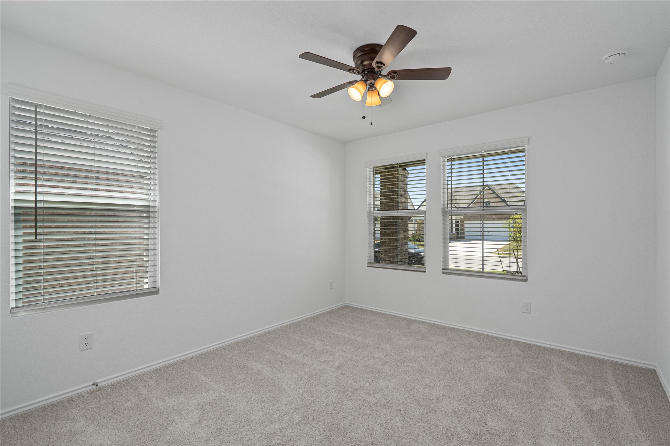 3305 Everett Kyle, TX 78640 - Photo 10 of 21 Guest bedroom with carpet and ceiling fan