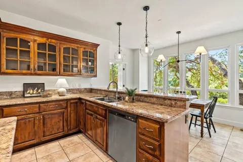 a kitchen with a sink stove and cabinets