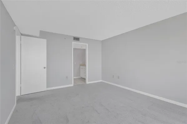 a view of an empty room and entryway