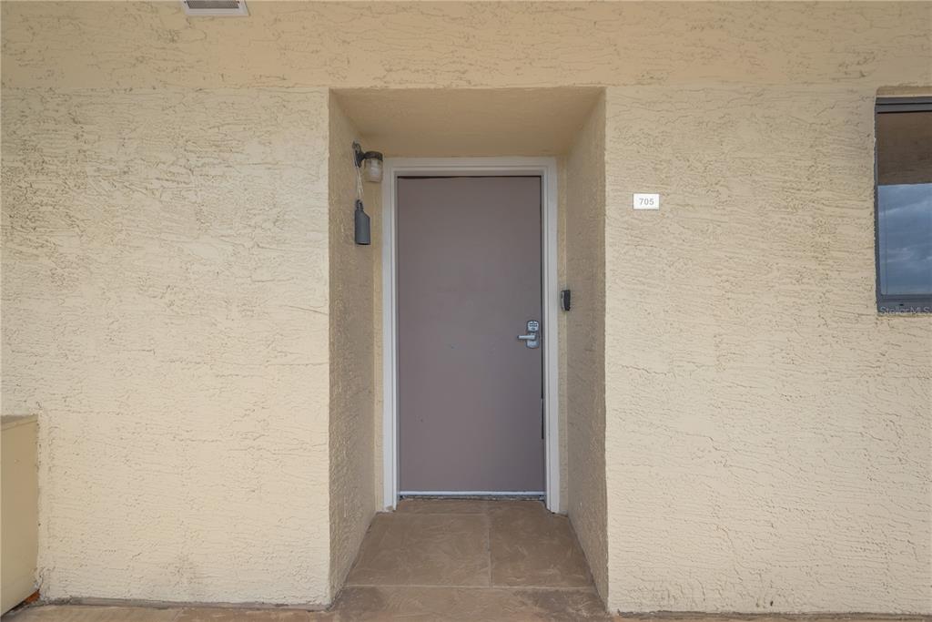 6009 Sea Ranch Drive, Unit 705 Hudson, FL 34667 - Photo 25 of 43 a view of a hallway