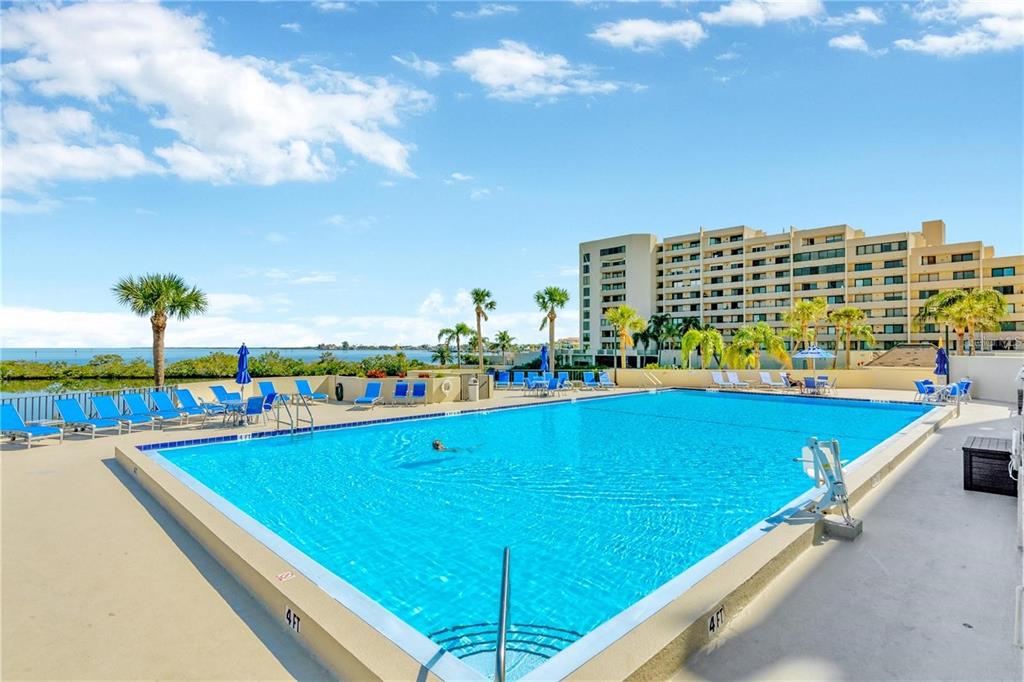 6009 Sea Ranch Drive, Unit 705 Hudson, FL 34667 - Photo 35 of 43 a view of swimming pool with outdoor seating