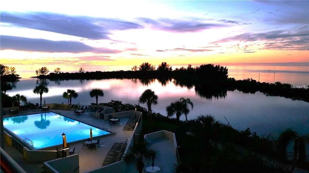 6009 Sea Ranch Drive, Unit 705 Hudson, FL 34667 - Photo 36 of 43 a view of a lake from a yard