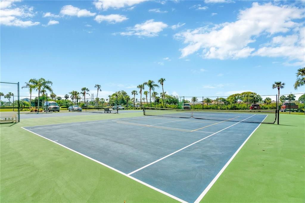 6009 Sea Ranch Drive, Unit 705 Hudson, FL 34667 - Photo 37 of 43 a view of a tennis court