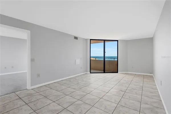 a view of an empty room with a window