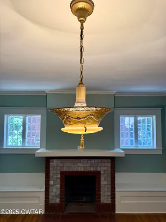 a water fountain in a living room with a fireplace