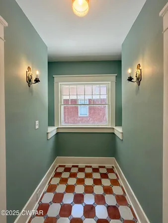 a room with a black and white checkered floor