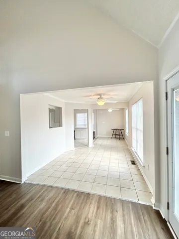 a view of hallway with wooden floor