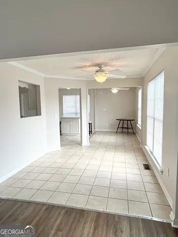 a view of an empty room with a window