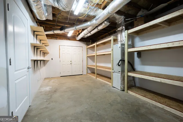 a view of a lake with houses in the background