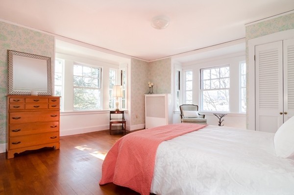 86 Warren Street Needham, MA 02492 - Photo 13 of 24 a bedroom with a bed and a dresser