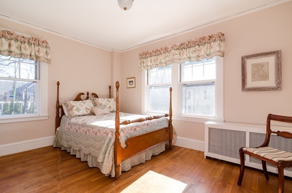 86 Warren Street Needham, MA 02492 - Photo 15 of 24 a bed room with a bed and a chair