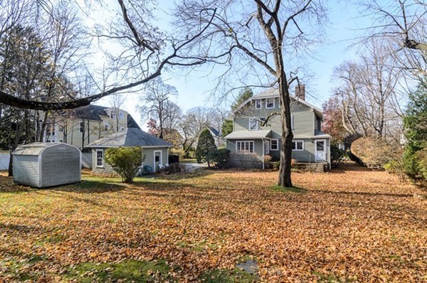 86 Warren Street Needham, MA 02492 - Photo 23 of 24 a view of a house with a yard covered in snow