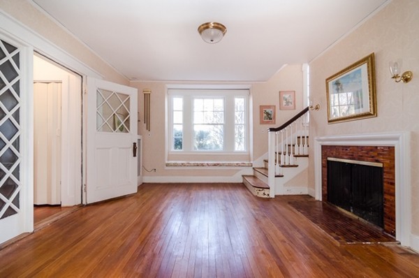 86 Warren Street Needham, MA 02492 - Photo 3 of 24 wooden floor fireplace and windows in an empty room