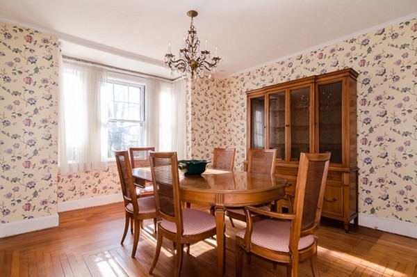 86 Warren Street Needham, MA 02492 - Photo 9 of 24 a view of a dining room with furniture and wooden floor