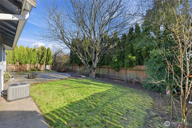 a view of backyard with swimming pool