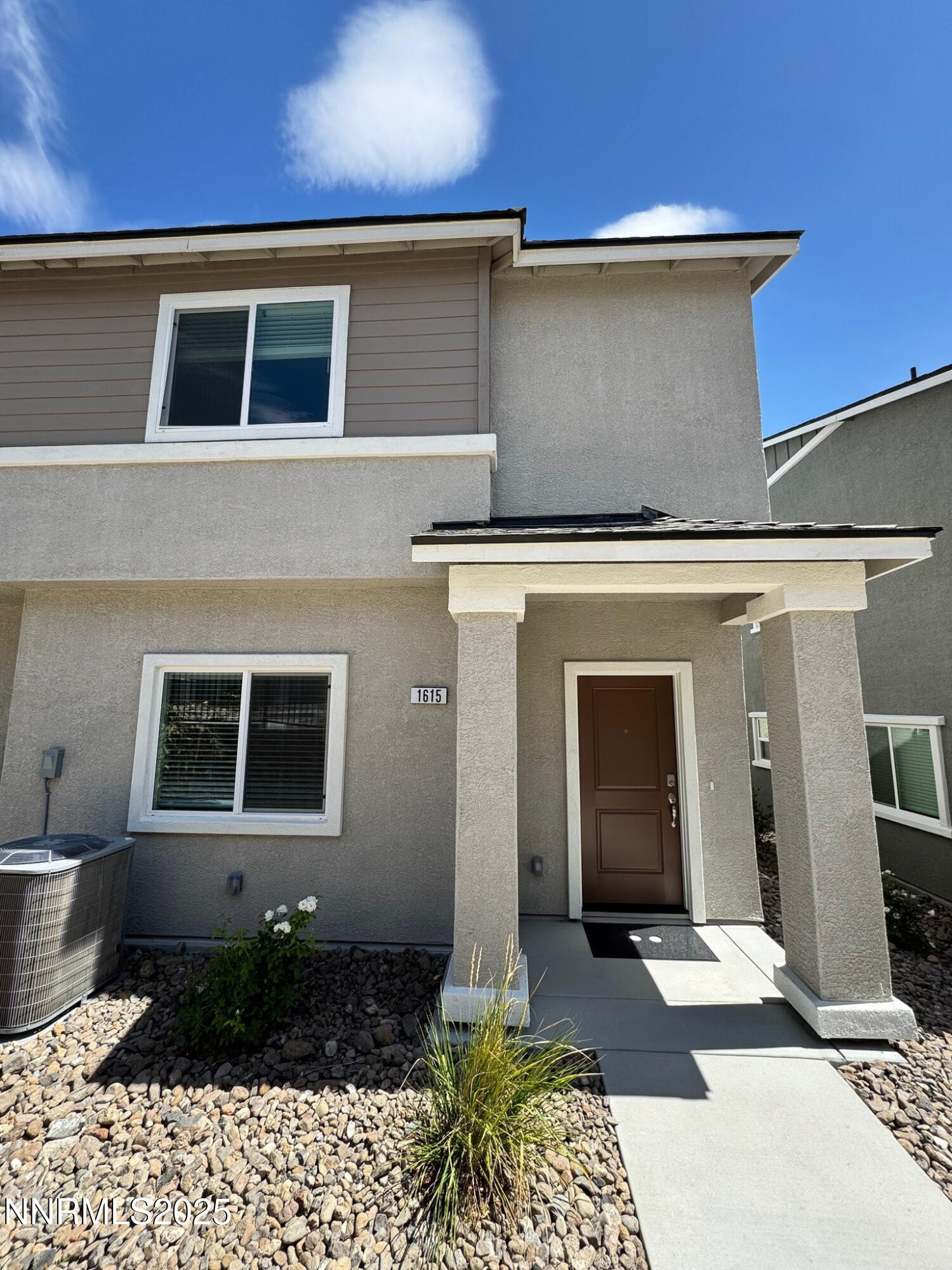 1615 Prancer Street, Unit LOT #53 Reno, NV 89523 - Photo 1 of 34 a front view of a house with garden