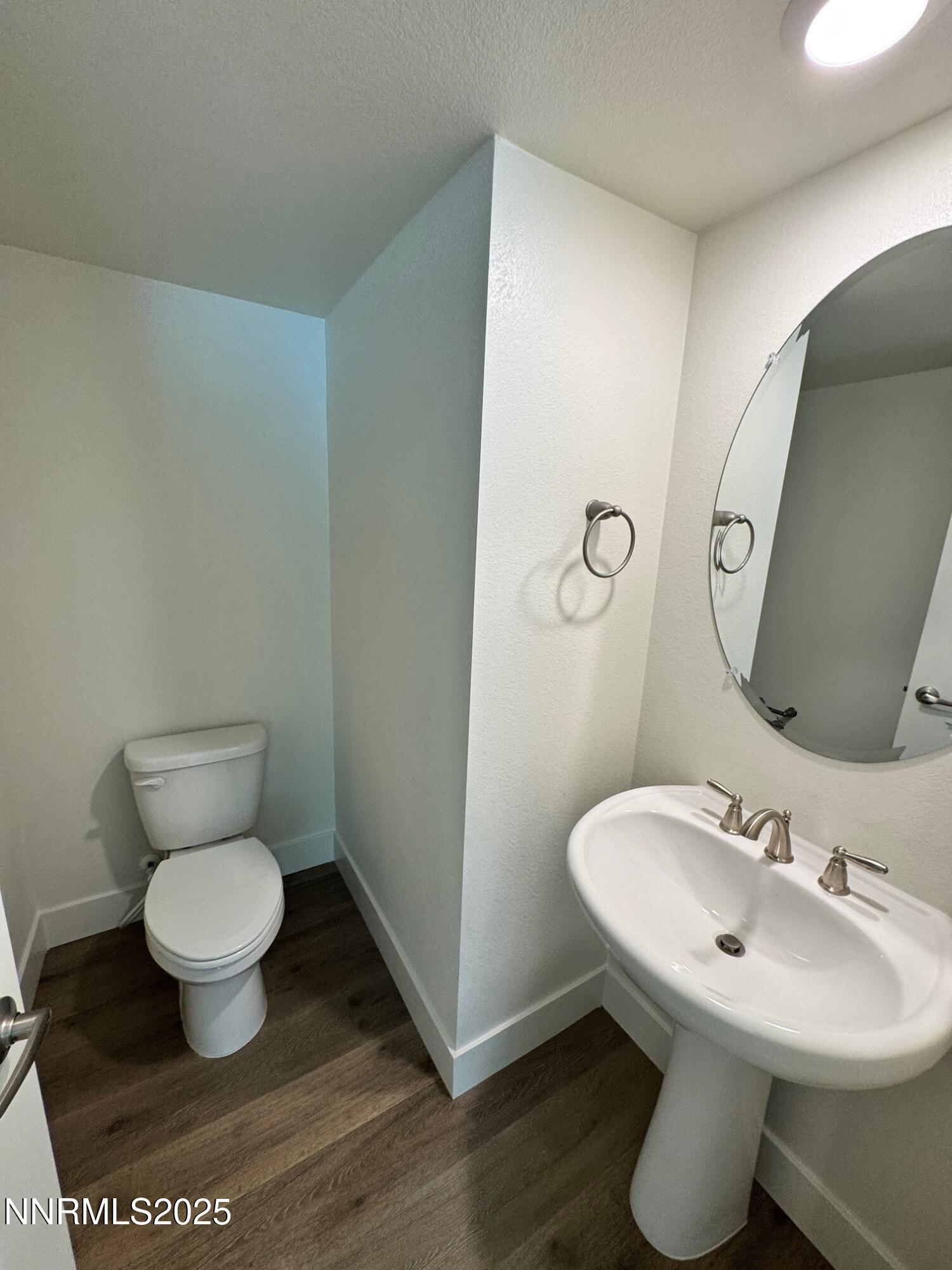 1615 Prancer Street, Unit LOT #53 Reno, NV 89523 - Photo 11 of 34 a bathroom with a toilet sink and mirror