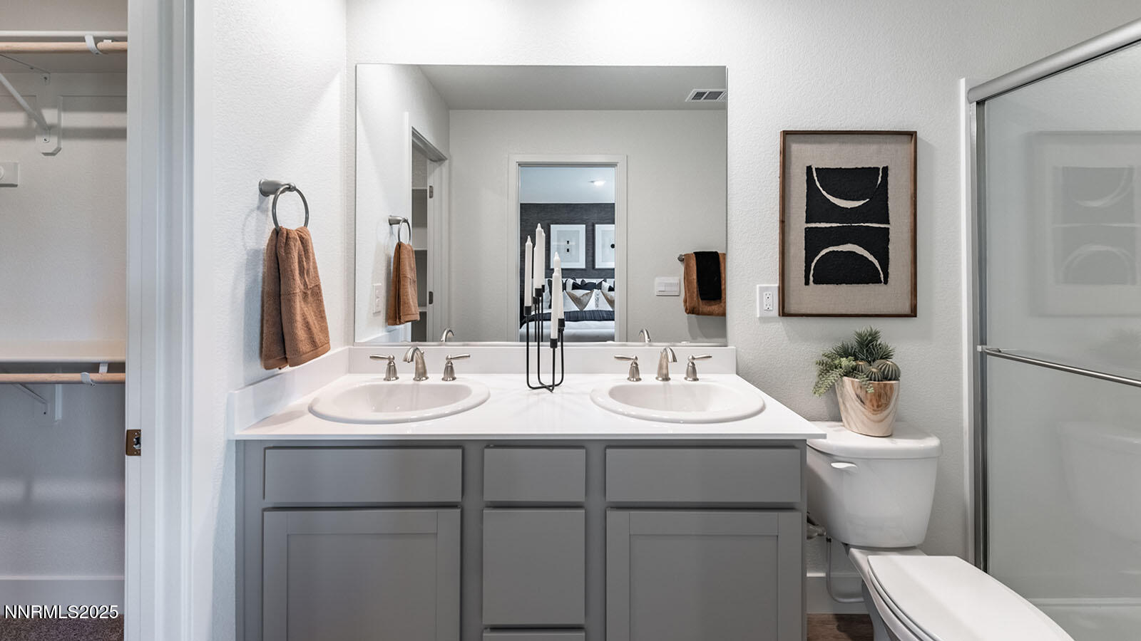 1615 Prancer Street, Unit LOT #53 Reno, NV 89523 - Photo 28 of 34 a bathroom with a toilet sink and mirror