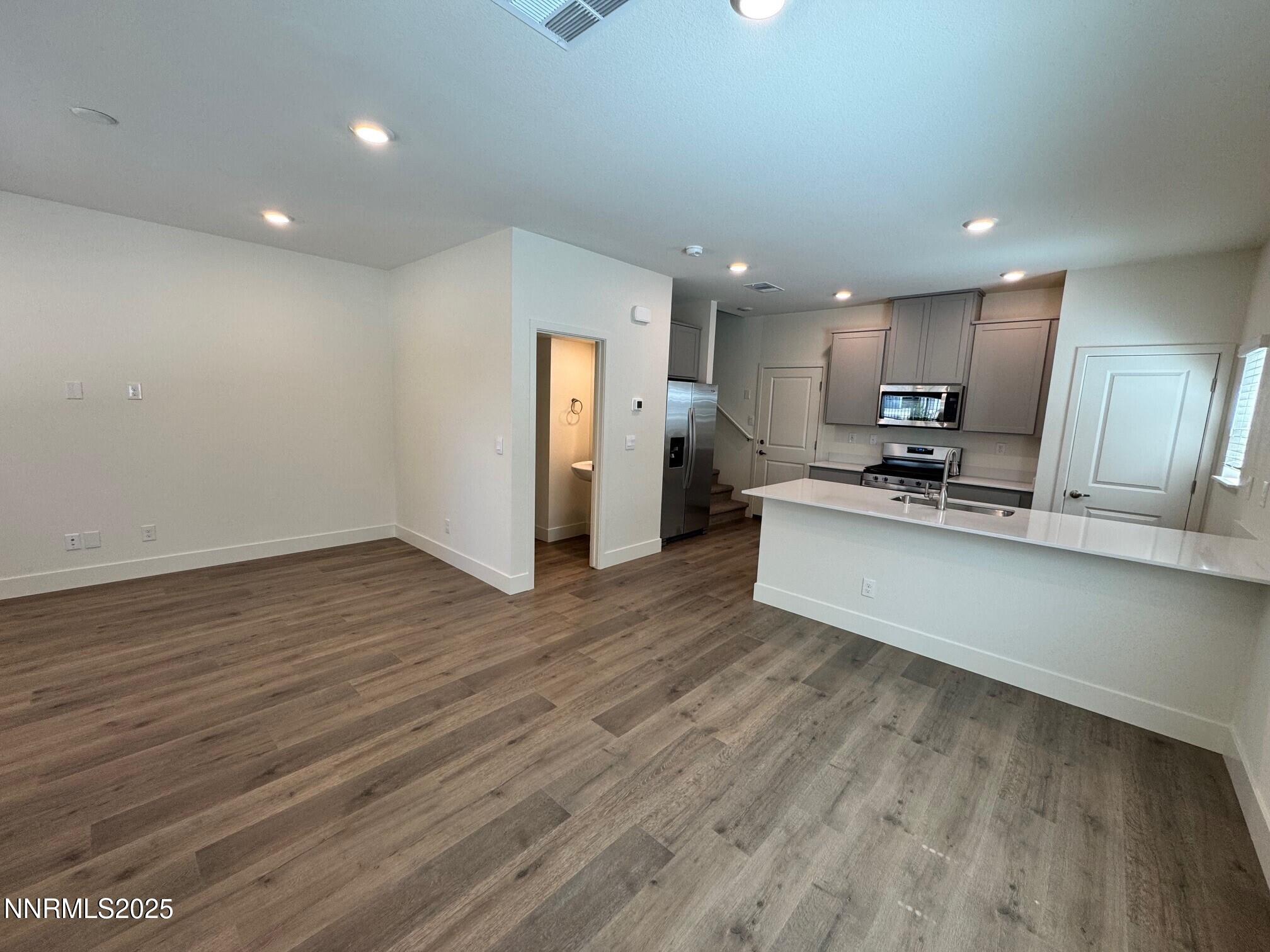 1615 Prancer Street, Unit LOT #53 Reno, NV 89523 - Photo 3 of 34 a view of kitchen with wooden floor and electronic appliances