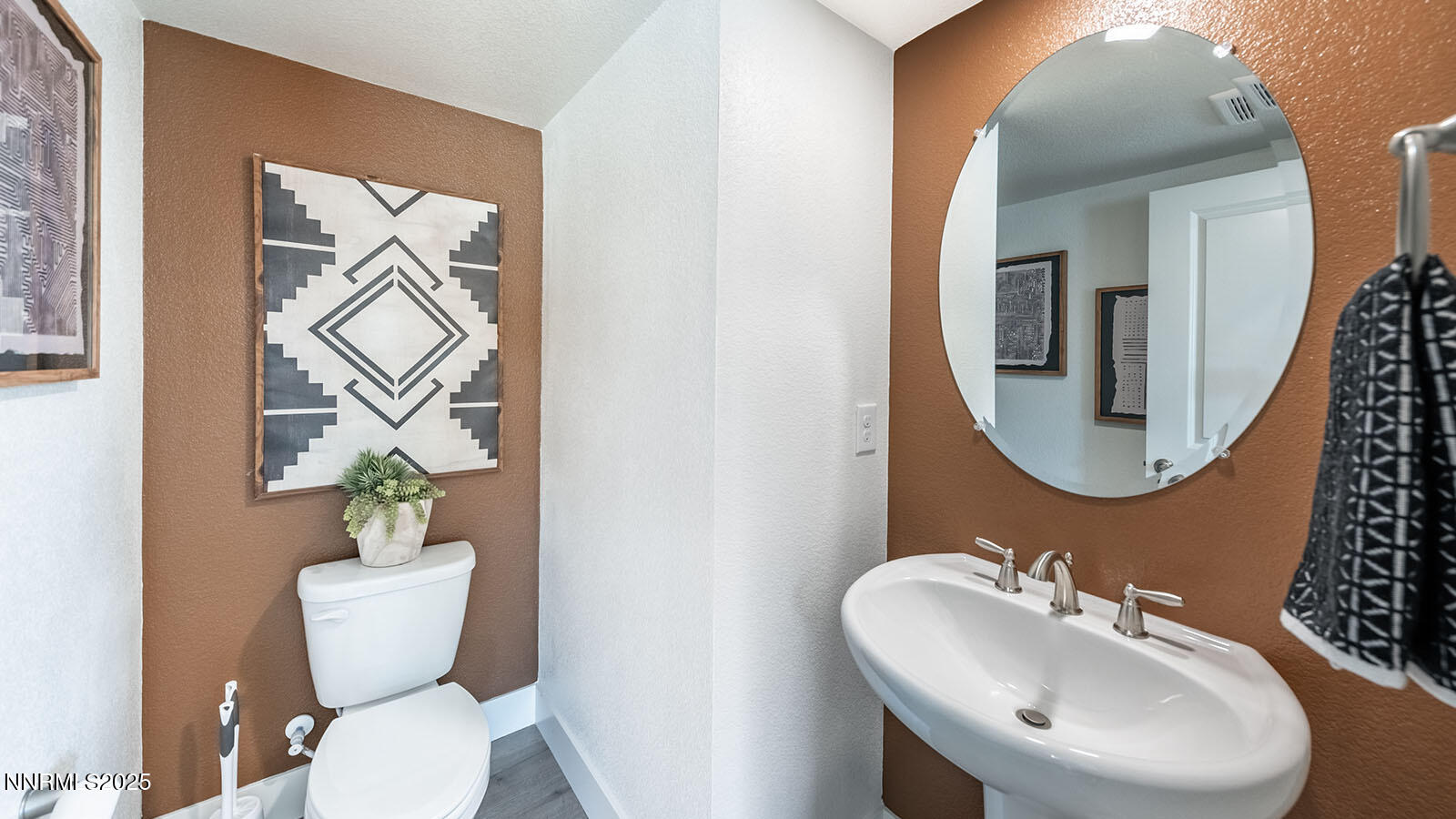 1615 Prancer Street, Unit LOT #53 Reno, NV 89523 - Photo 33 of 34 a bathroom with a toilet a sink and mirror