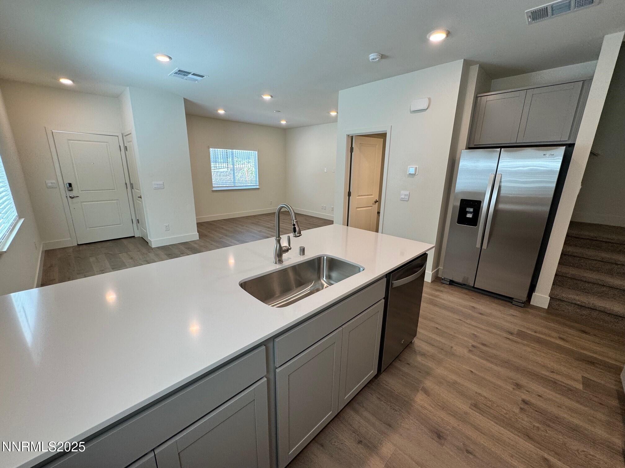 1615 Prancer Street, Unit LOT #53 Reno, NV 89523 - Photo 5 of 34 a kitchen with stainless steel appliances a sink a refrigerator and a stove