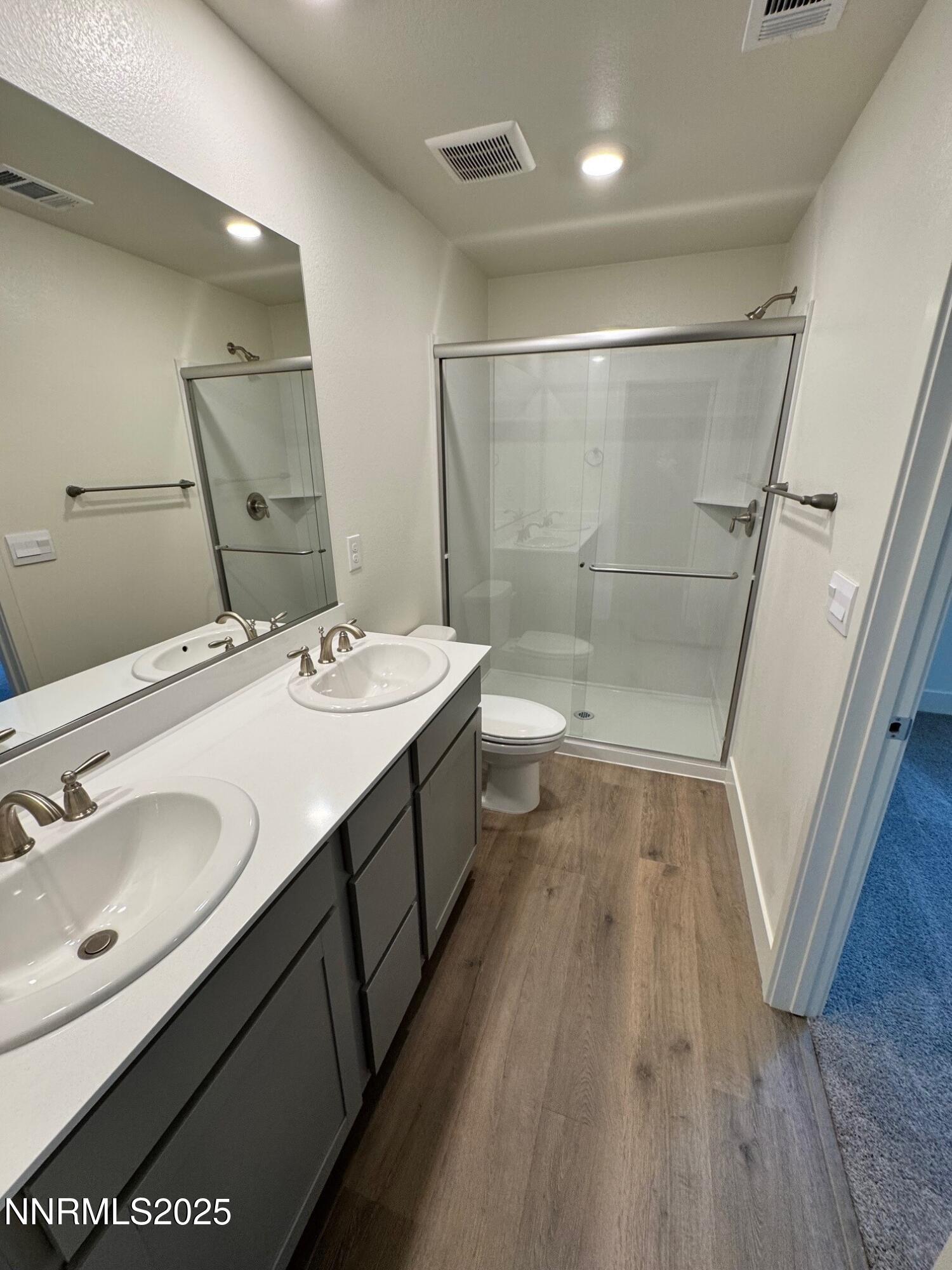 1615 Prancer Street, Unit LOT #53 Reno, NV 89523 - Photo 7 of 34 a bathroom with a double vanity sink and a mirror