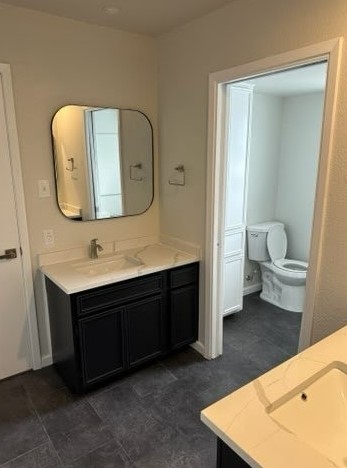 4520 Speedway, Unit A Austin, TX 78751 - Photo 15 of 18 Dark cabinetry and light stone countertops anchor this thoughtfully configured bathroom layout.