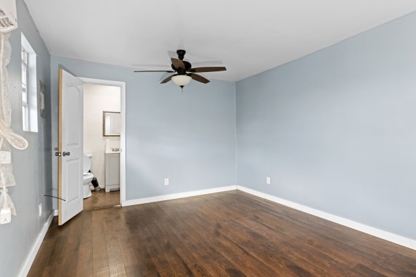 9702 Tiltree Street Houston, TX 77075 - Photo 15 of 24 wooden floor in an empty room with a window