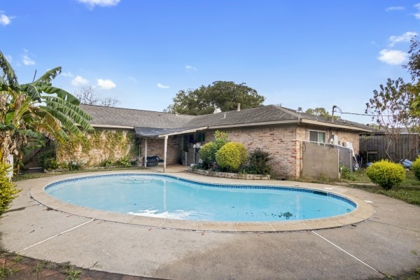 9702 Tiltree Street Houston, TX 77075 - Photo 20 of 24 a view of outdoor space yard and swimming pool