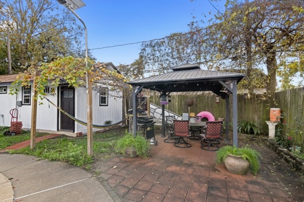 9702 Tiltree Street Houston, TX 77075 - Photo 22 of 24 a view of a chairs and table in backyard of the house