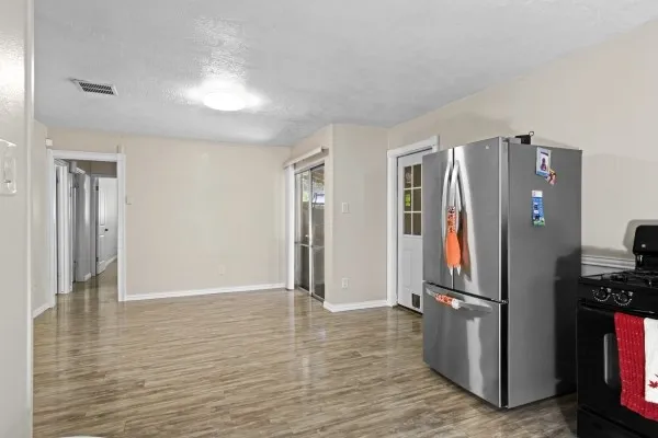 a view of a chairs and table in backyard of the house